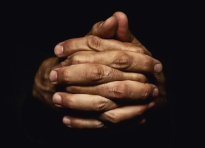 Hands crossed in prayer